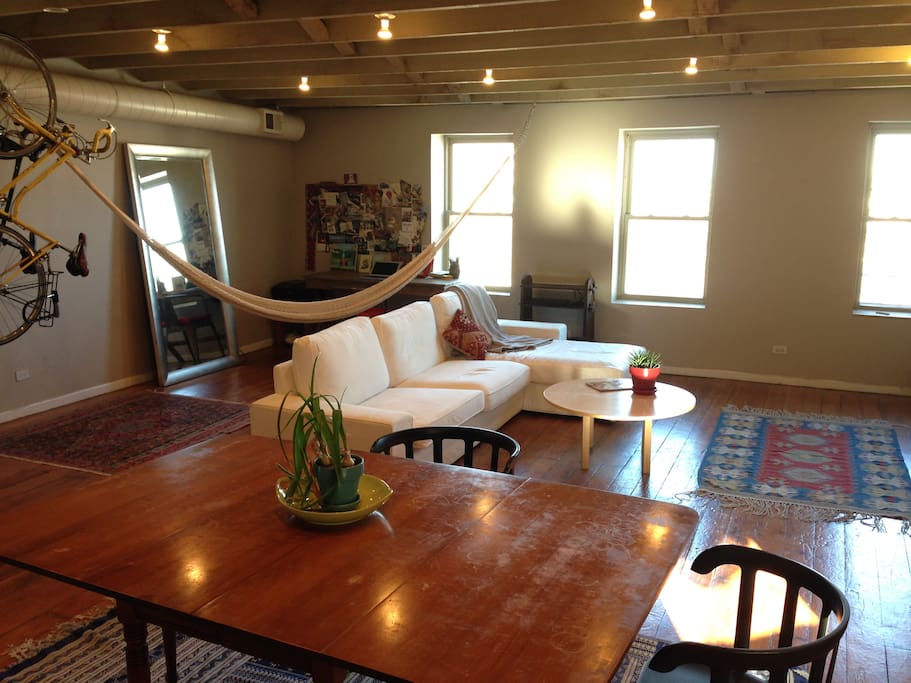 Living, dining and office area. Cozy couch with chaise for city views!