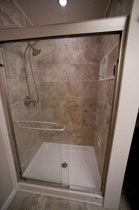 Private bath with luxurious shower.