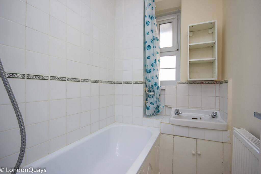 Small nice bathroom with bathtub and separate toilette