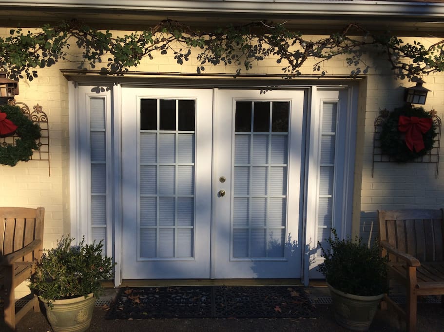 Carriage House downstairs studio entrance. Center french door entrance.