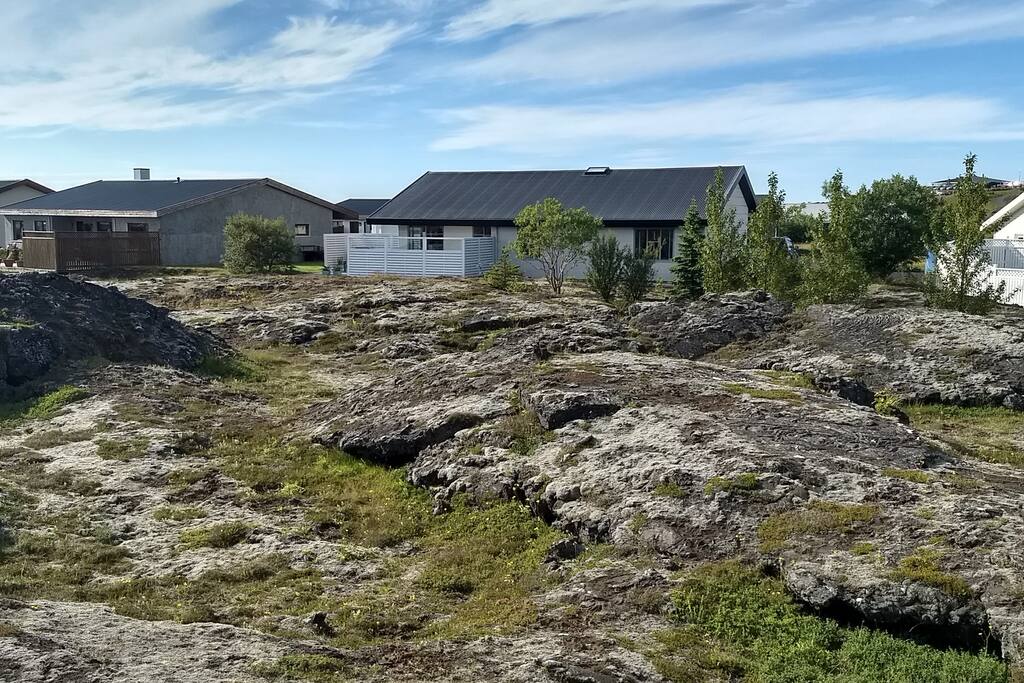 Our home with a large lava field in the backyard