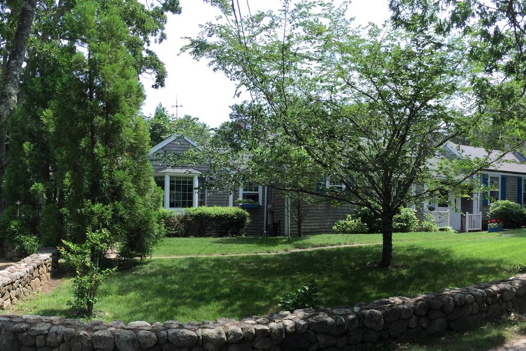 Gravel parking bays to left of house