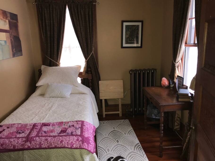 New firm memory foam mattress on new box spring. Plush bedspread and flannel sheets adorn this super comfy bed. Drift off to sleep in this cozy room or do some reading at the antique desk overlooking the front yard. You might catch a glimpse of the large eagles that fly up from the river on the occasional morning.