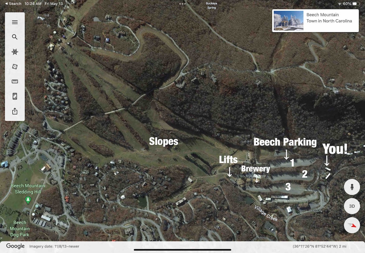 An aerial image displays Beech Mountain, highlighting ski slopes, lifts, and the surrounding community. Key locations are marked, including the brewery and parking areas. The terrain shows a mix of wooded areas and open spaces, representing the mountain's recreational features.
