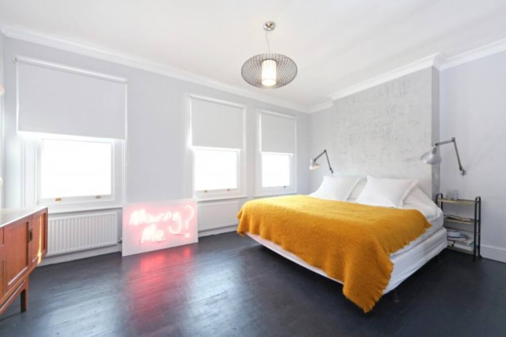 Large, double bedroom with super kingsize bed and built in wardrobes.
