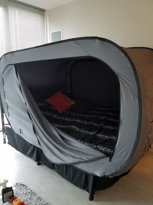 Studio apartment with tempurpedic mattress tent bed. For privacy & keeping space dark during sleep.