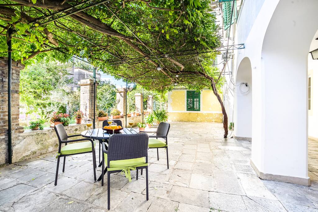 Front yard has a dining table and four chairs.
