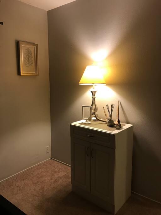 Small storage dresser, lamp and decor