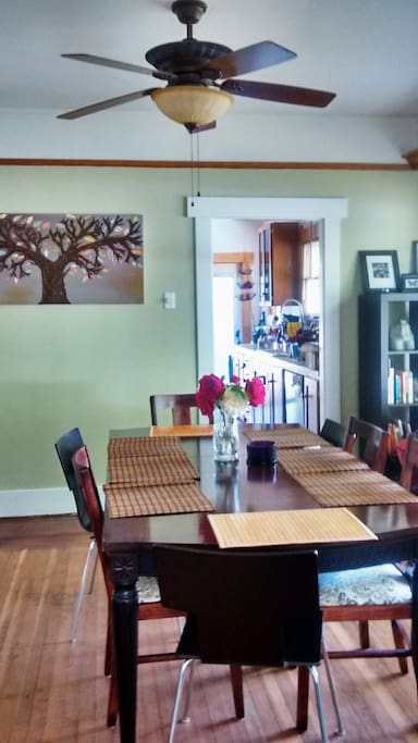 Bright dining room with large kitchen table.