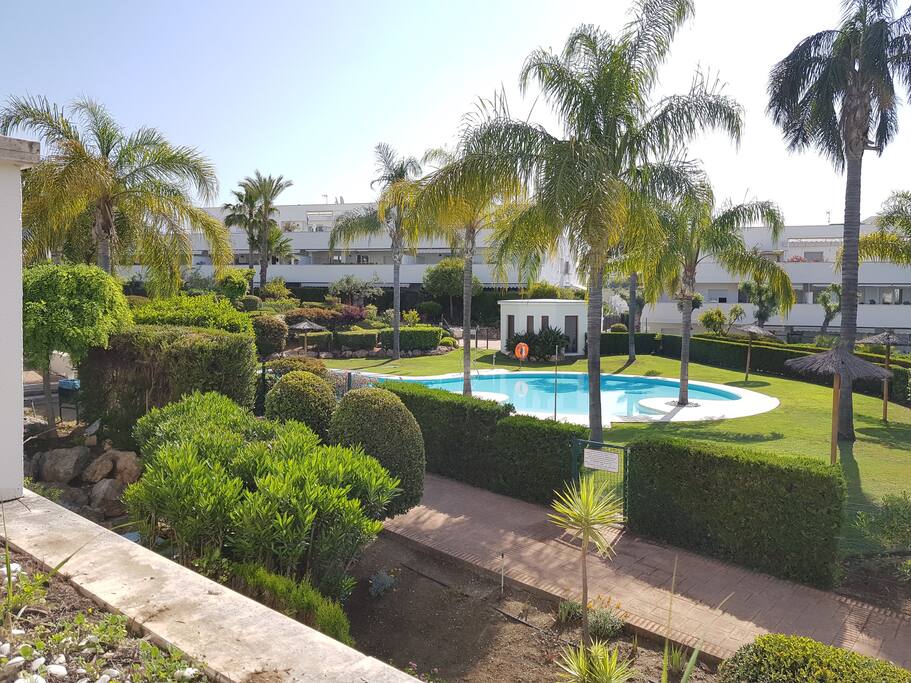 From the terrace, you can enjoy the tropical garden & pool view...and watch the kids swimming!
