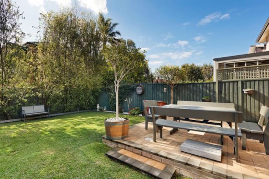 Backyard which includes BBQ and eating area