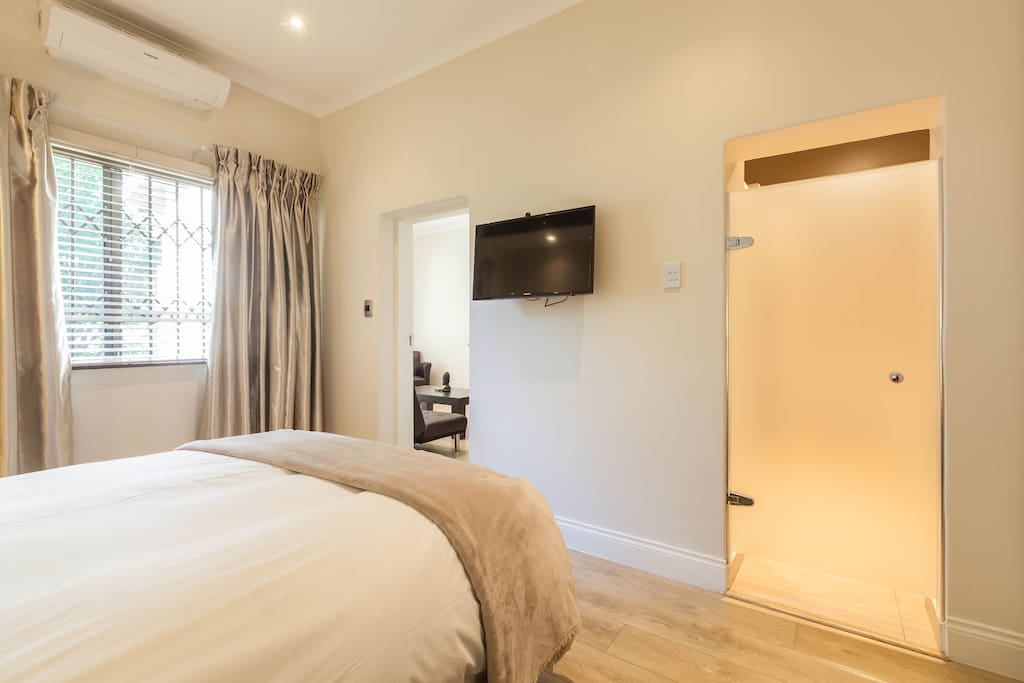 En-suite bedroom with LCD television