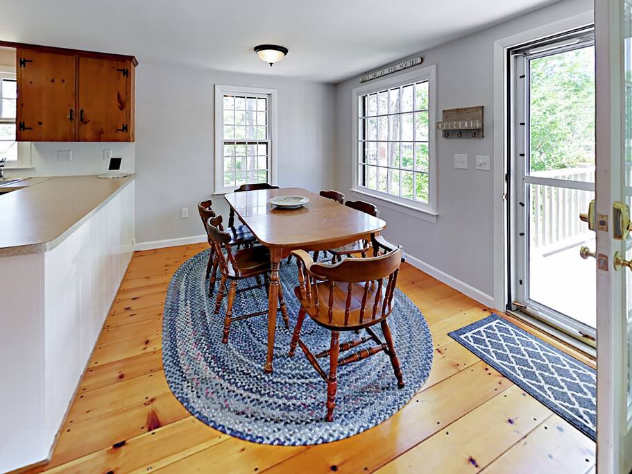Large windows flood the dining area with natural light.