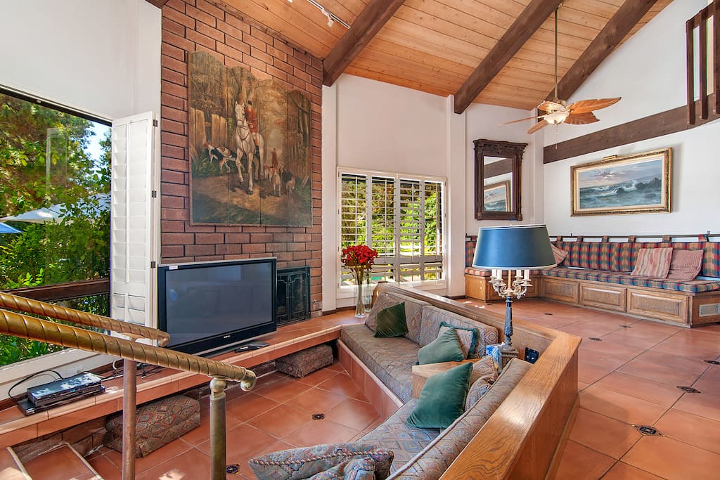 Come together in front of the TV or fireplace on the second living area's sunken couch, or grab a seat on the bench in the corner for conversation.