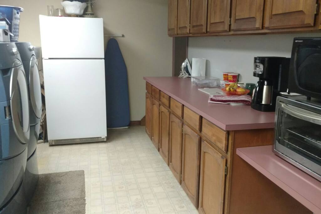 Laundry room / kitchette / fridge / microwave / coffee pot. Shared area in basement.