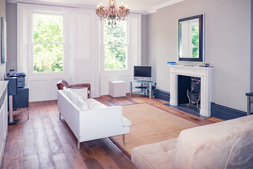 First floor lounge at the front of the house with double sofa bed and TV