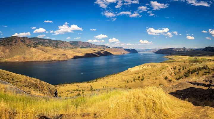 image of a lake with rolling hills