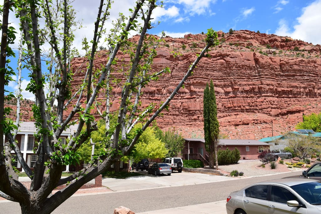 View of red rock cliff from front of house