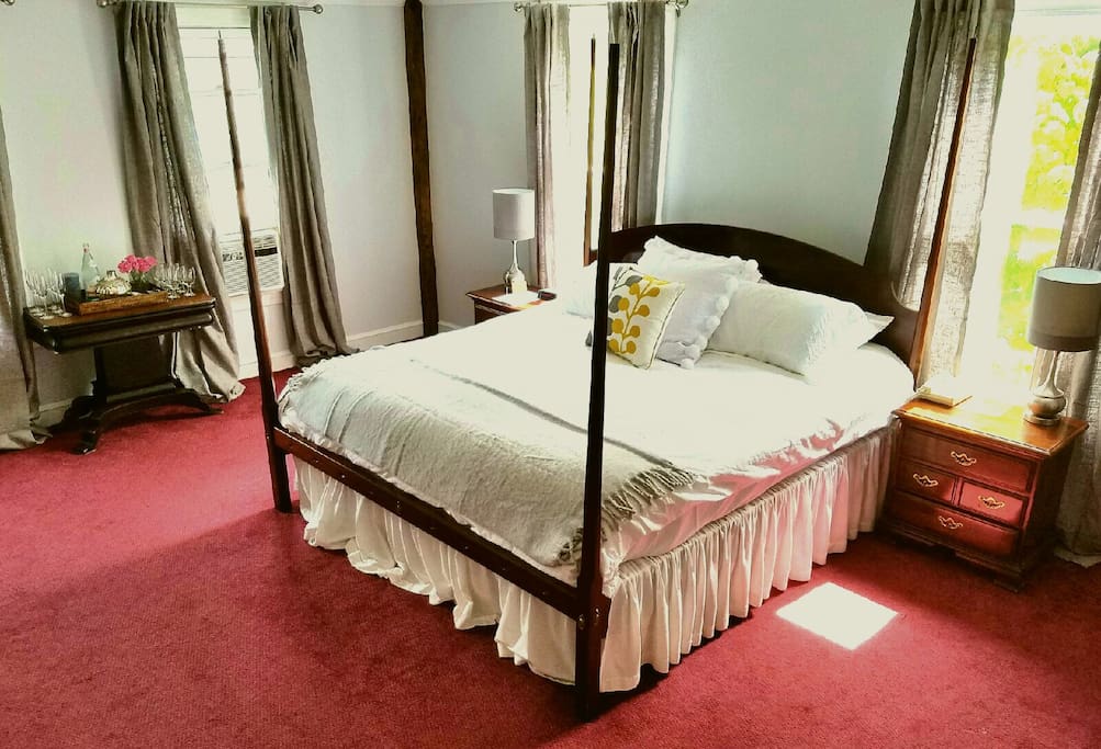 King size bed in spacious room with private bath.