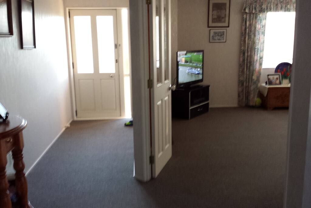 front entrance walking into dining and kitchen,lounge on right