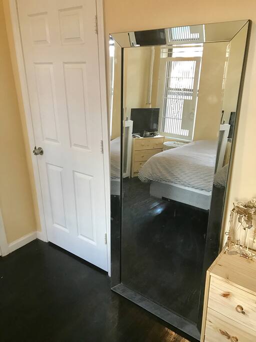 Private very clean room, large mirror, and wood floors.