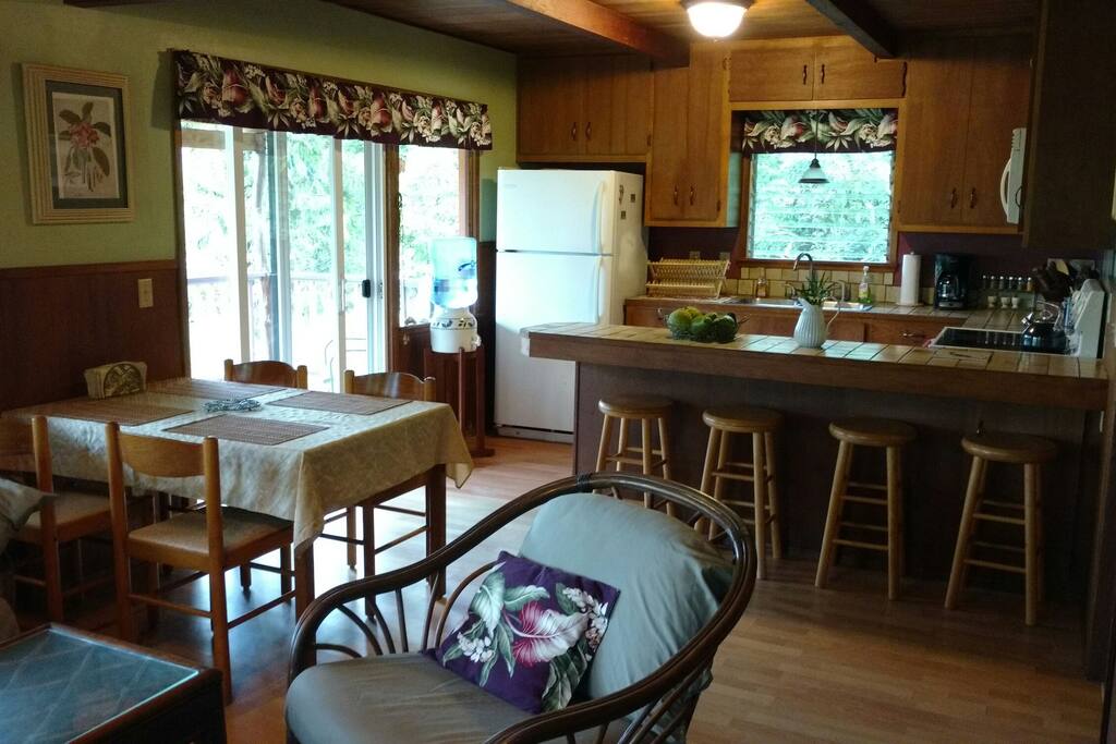 Cottage Dining Areas looking into the Kitchen, and Sliding Glass Door to the Lanai.