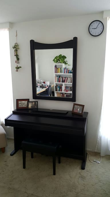 Study featuring city views, piano, bar and work desk along with many classic books for your enjoyment.