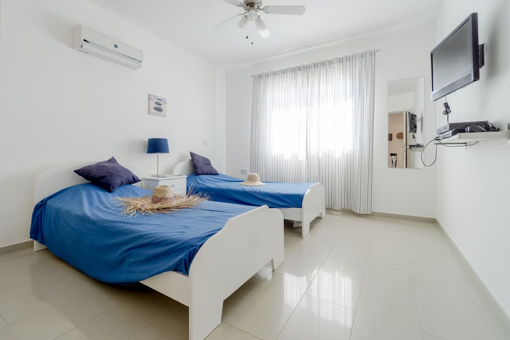 Sunny twin bedroom.