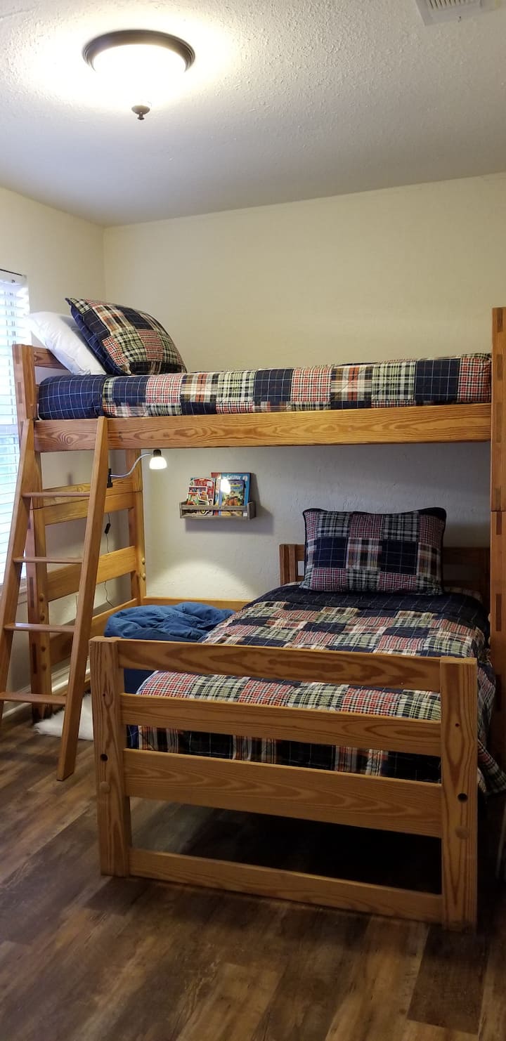 Twin size bunk beds with reading nook.
