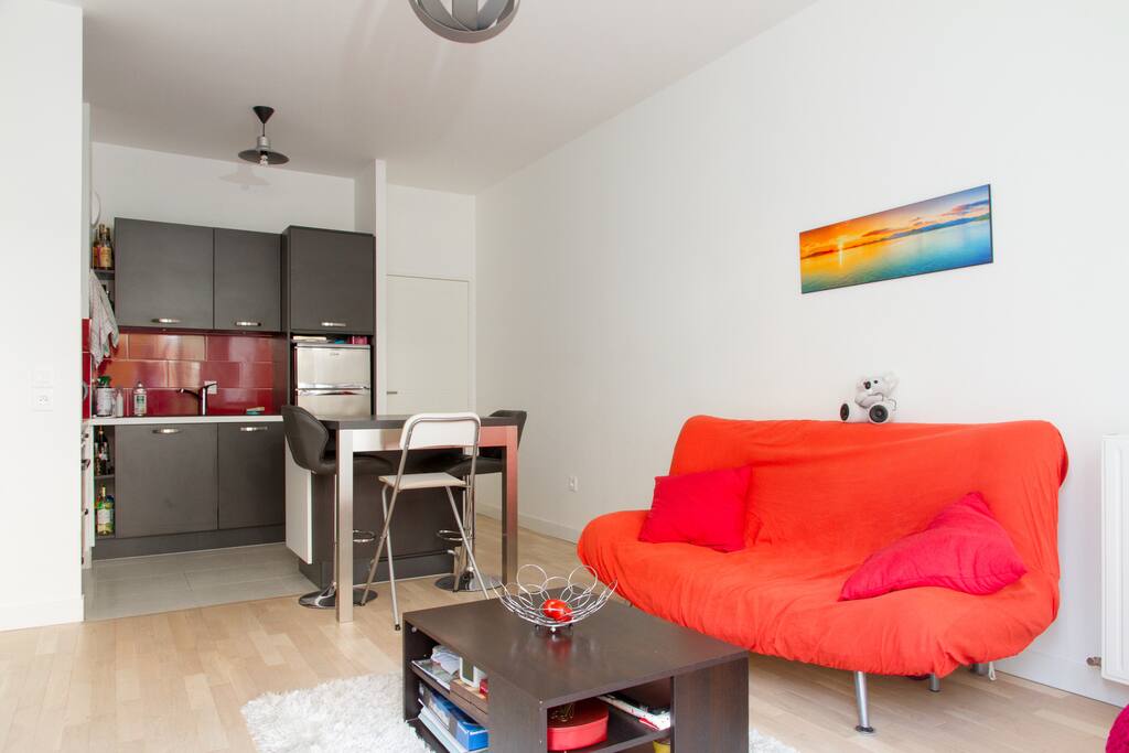 The living room has an open kitchen connected to it