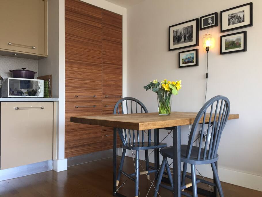 Living room diner with bay views, sofa, kitchen table to seat 4