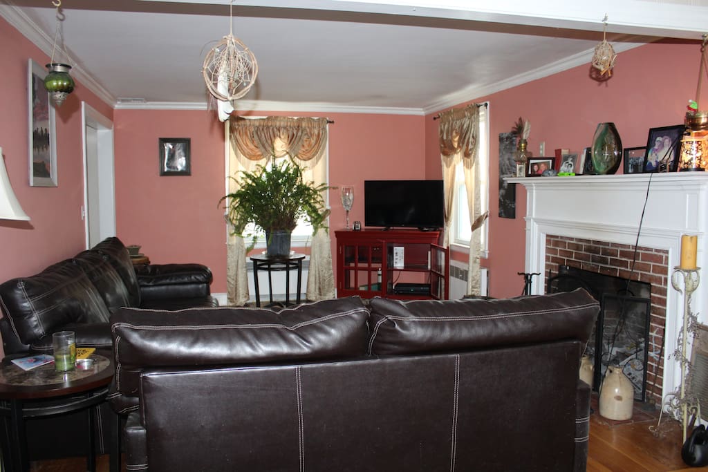 Spacious living room with fire place. There is a second fire place outside to enjoy a quiet evening with a glass of wine and the stars.