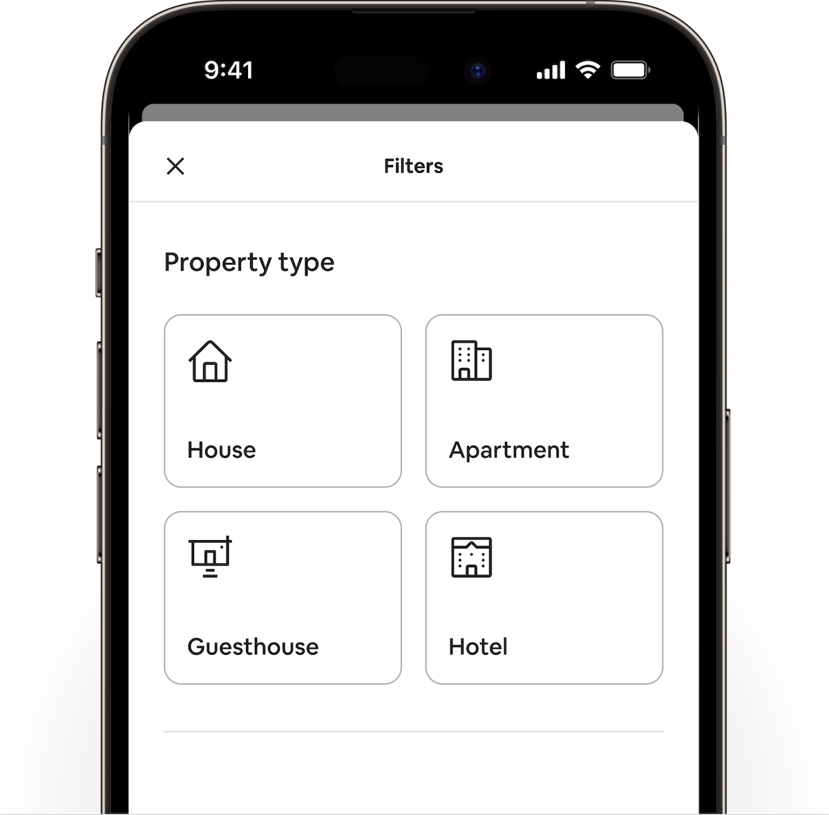 A phone with the Airbnb app open to the filters menu. Four different buttons form a grid highlighting the different property types house, apartment, guesthouse, and hotel. Each has an icon outlined in black.