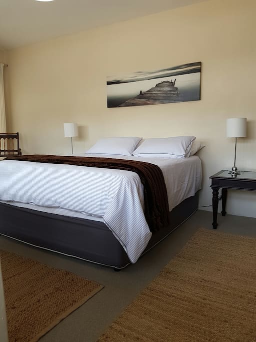 Large airy bedroom with queen size bed
