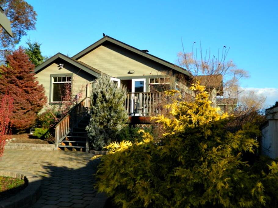 Back of home with deck and private patio