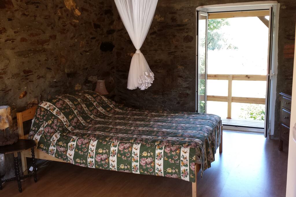 bedroom 1 with french doors to veranda