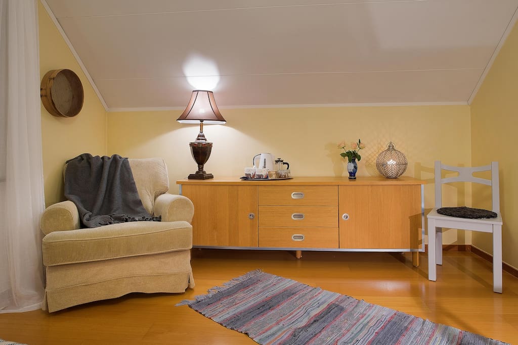 Relax corner of main bedroom. Enough space to add 1-2 extra beds for young kids who want to stay in same room as parents