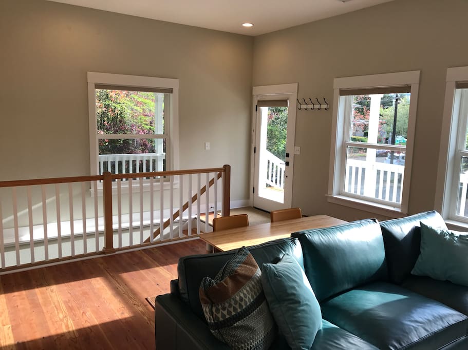 The main door to the house opens up to the living space. Down the stairs to will find the washer/dryer, a second bedroom with a futon, a half bath, and access to the garage.