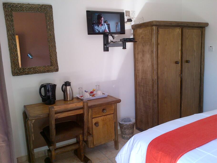 TV and desk in room. Free WIFI available.