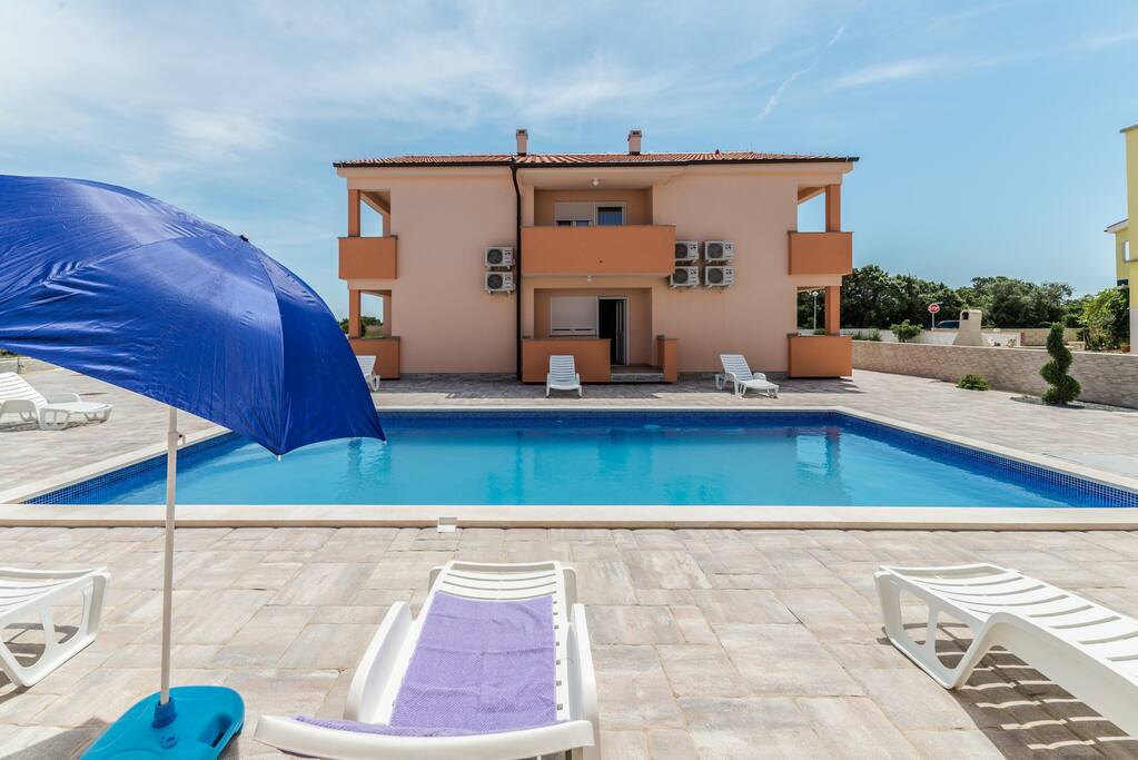 Loungers, parasols, outdoor shower