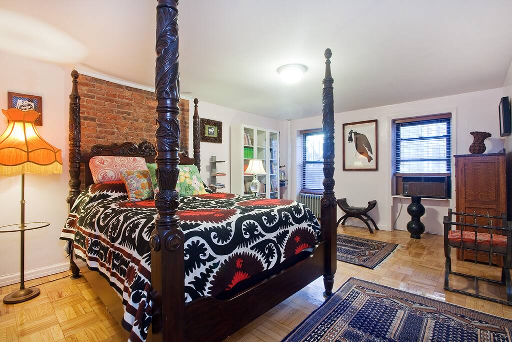 glorious master bedroom with comfy reproduction antique queen sized bed