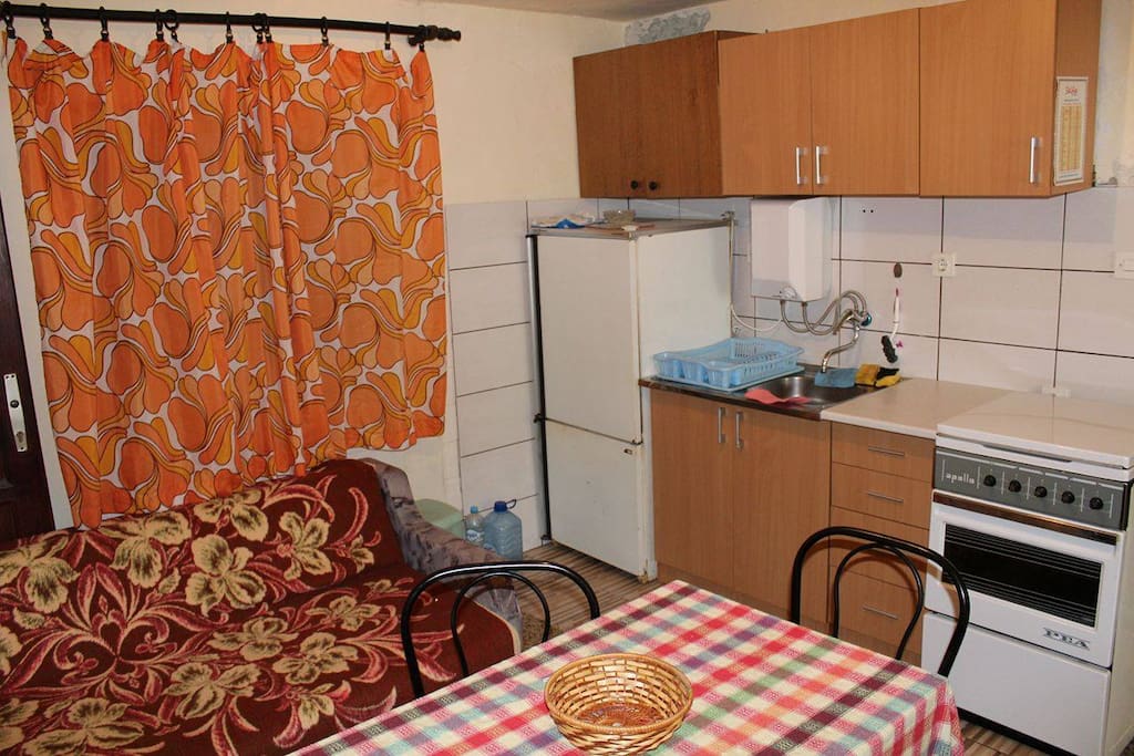 Kitchen and diningroom with an additional cozy sofa.