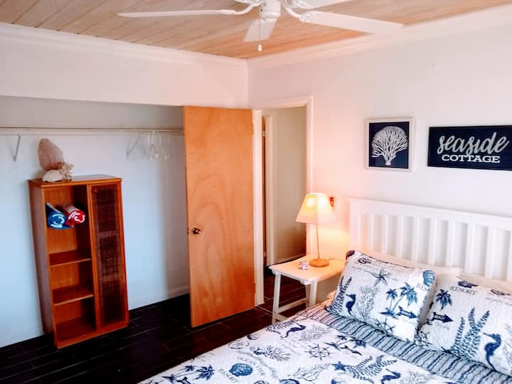 Guest bedroom has lots of natural lighting and is very quiet at the rear of the house.