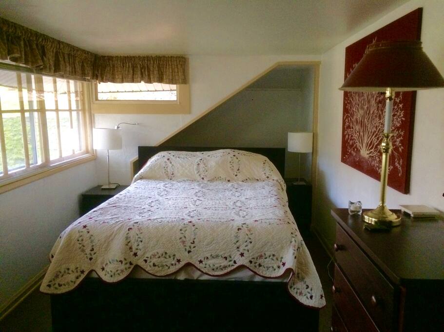 Bedroom 1. Queen bed with cotton sheets and spread.