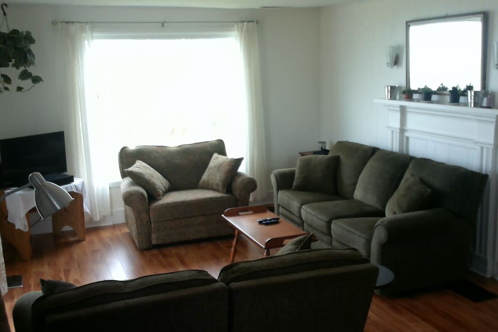 Family room with cable television and stunning views of the bay of Fundy