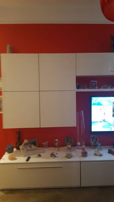 A cupboard with the big television