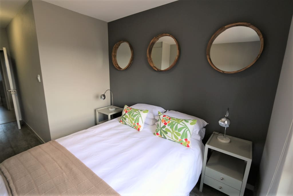 The flat has a very comfortable queen size extra length bed.
