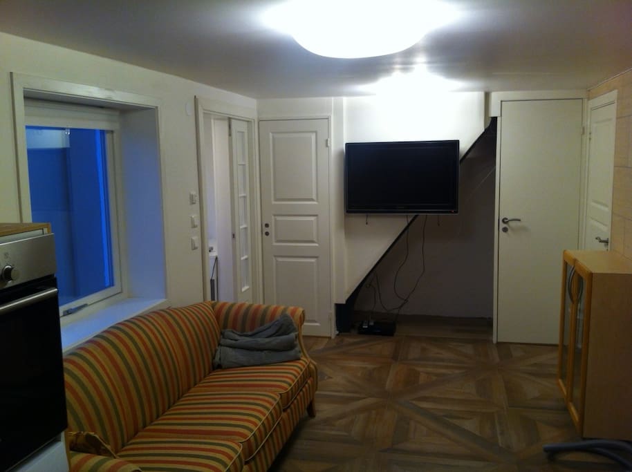 The TV is mounted on the wall and the stairs built in for improved noise-insulation.