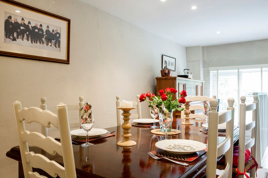 Dining table with 6 chairs. Additional chairs are provided