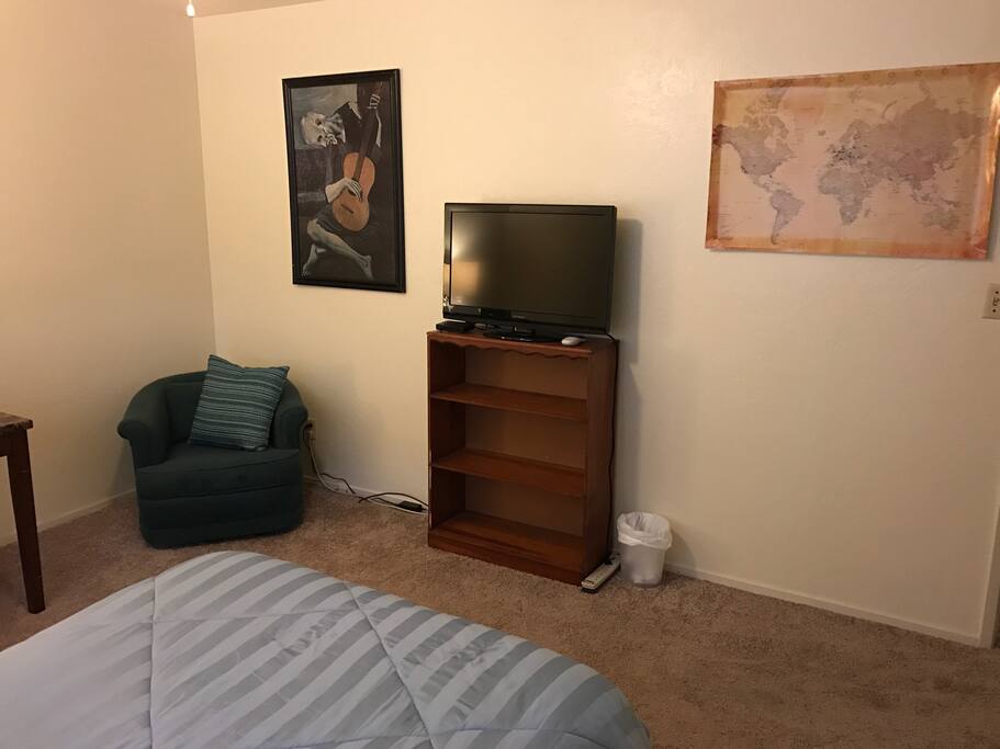 Comfy vintage chair and Directv with hundreds of channels.